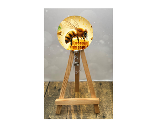 Cute honeybee badge pulls featuring a vibrant bee design on a badge reel with honeycomb and shine.