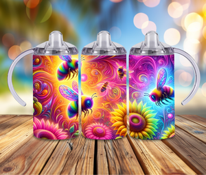 Colorful honeybee stainless steel tumblers with vibrant floral designs on a wooden table.