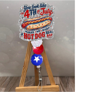4th of July badge pull featuring a hot dog design and festive glitter background, perfect for summer celebrations.