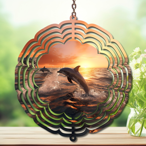 Dolphin aluminum wind spinner showcasing playful dolphins against a sunset, adding coastal charm to your outdoor decor.