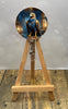 Eagle House badge pull with shimmer glitter displayed on a wooden easel featuring an eagle design.