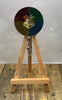 Wizard badge pulls on a wooden easel, featuring a colorful design with a magical emblem to add charm to your workday.