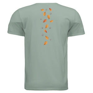 Back view of the Cozy Badger graphic tee featuring autumn leaves and paw prints on a soft mint green fabric.