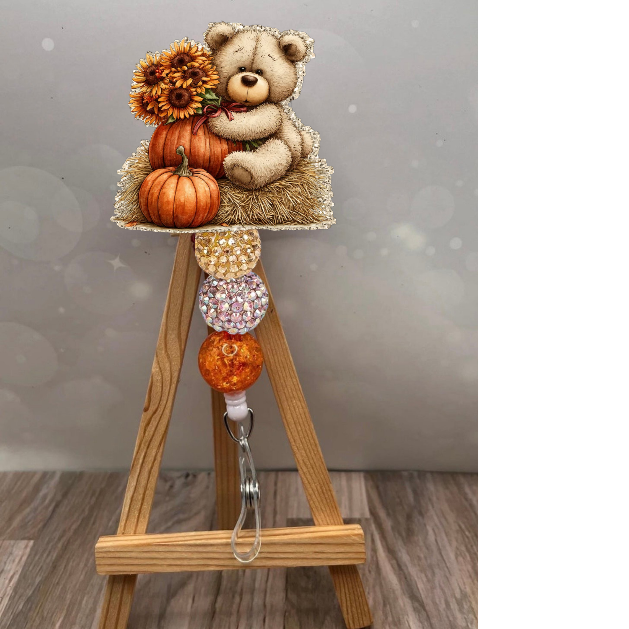 Fall bear badge reel with adorable bear and pumpkins, featuring champagne glitter background for a cozy seasonal touch.