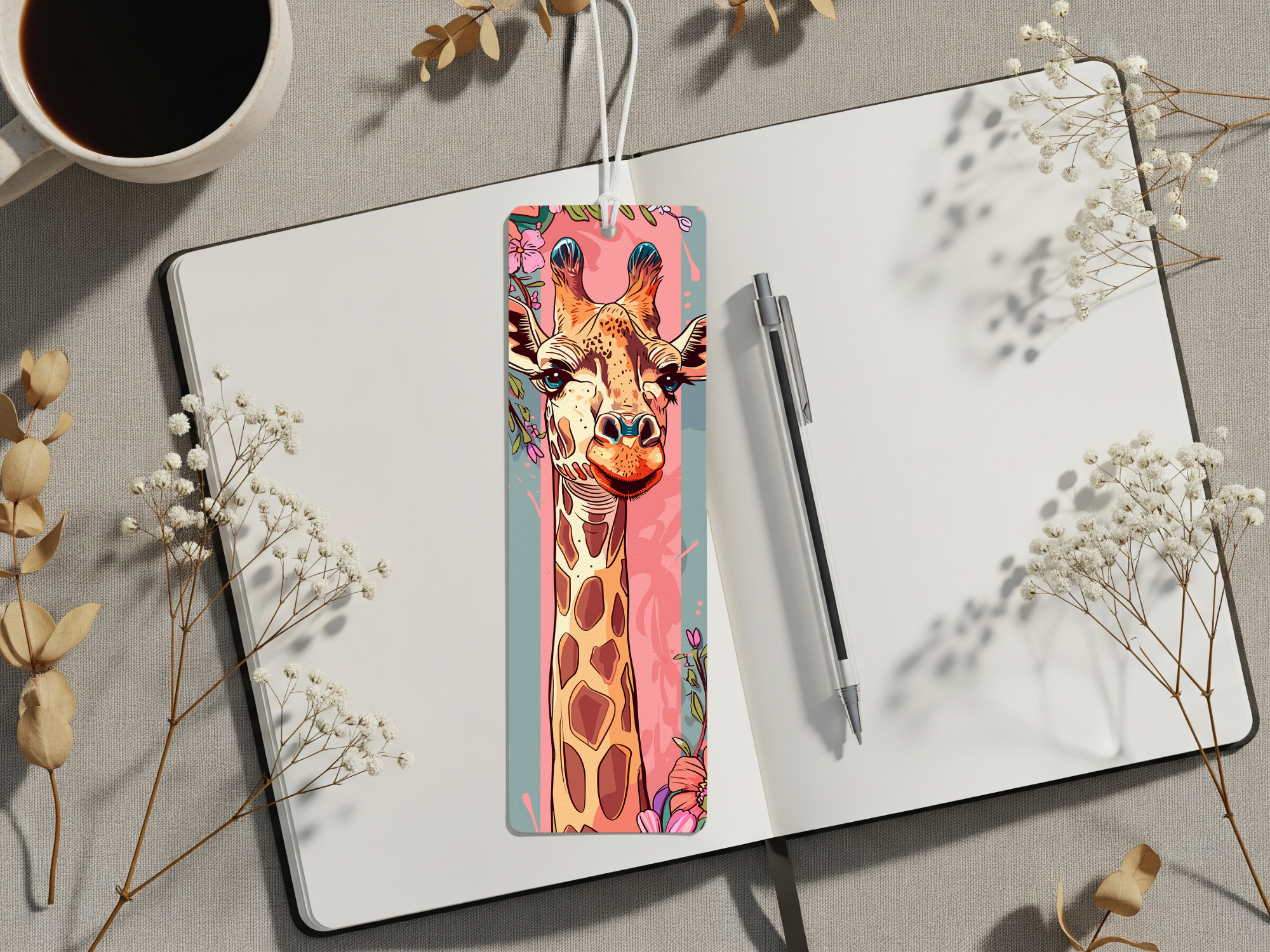 Giraffe metal bookmarks featuring playful giraffe artwork on a stylish bookmark placed on an open notebook.