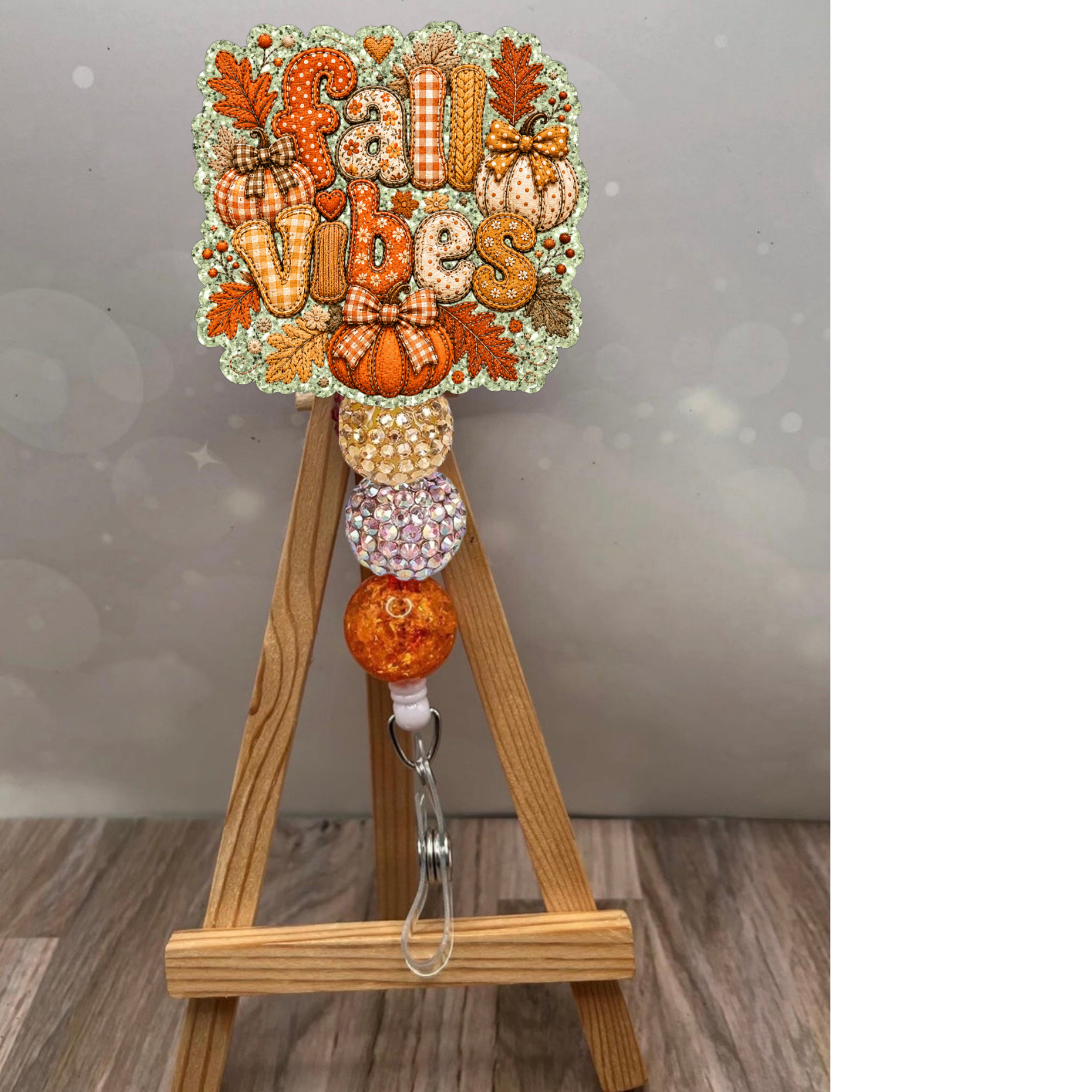Fall Vibes Patchwork Badge Reel for fall featuring cozy pumpkins and glittery beads, perfect for lanyards and badge holders.