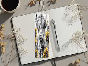 Highland cow metal bookmarks design featuring sunflowers on a notebook with a pen and coffee.