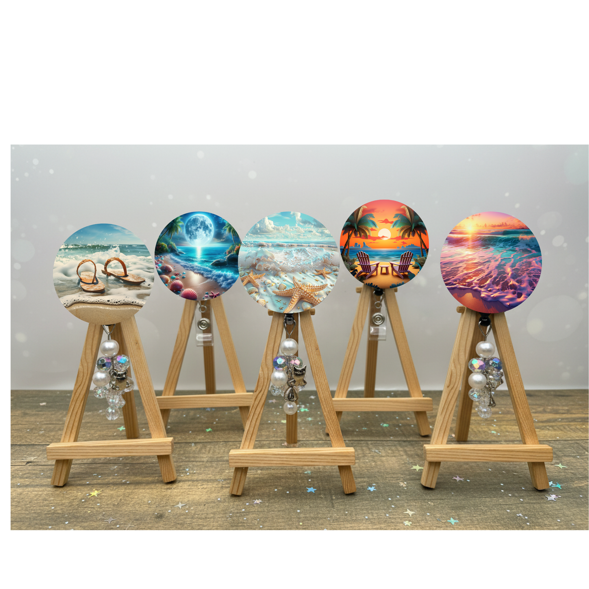 Beach badge pulls with glitter options displayed on easels featuring coastal designs and vibrant colors.