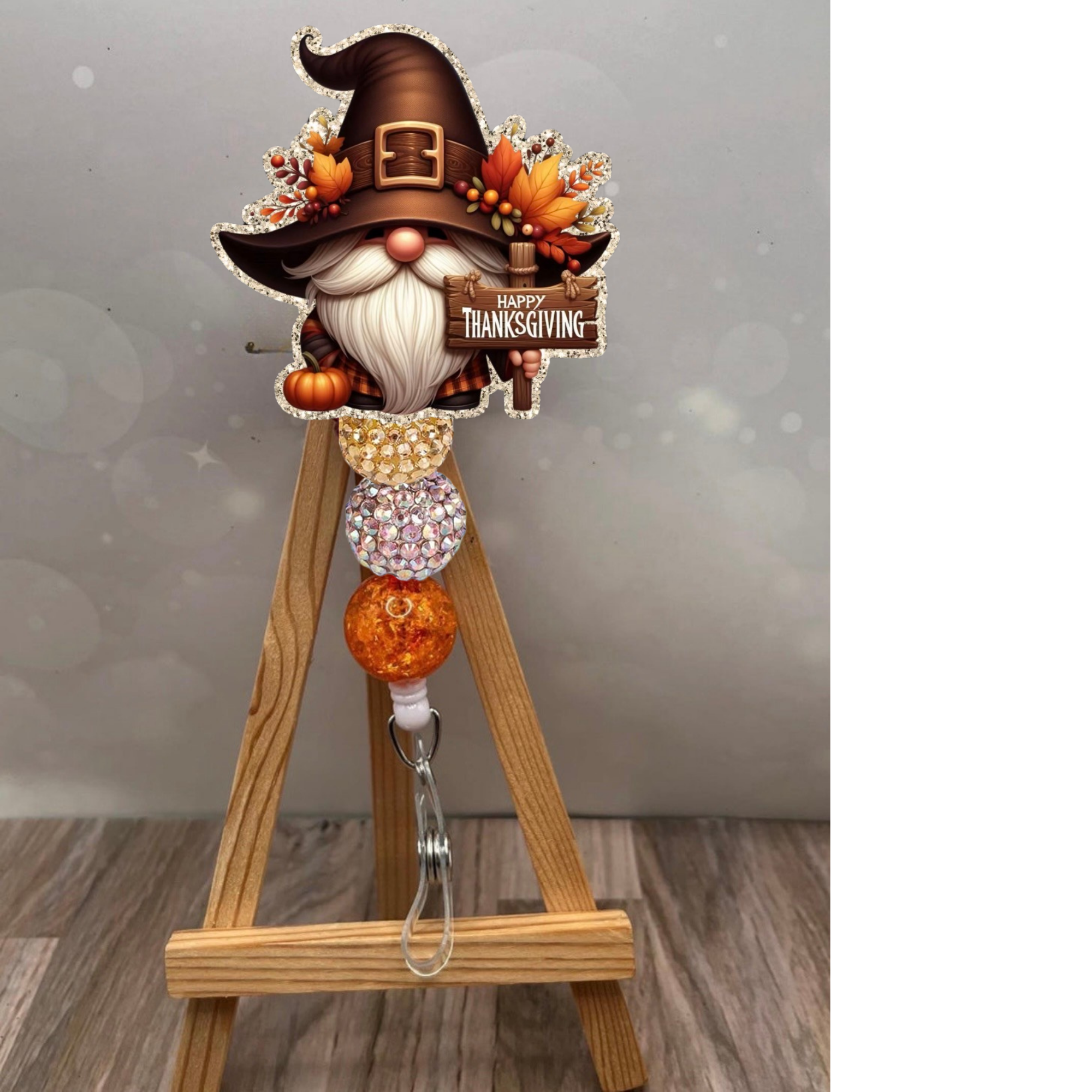 Thanksgiving gnome badge pull with glitter beads and a gnome wearing a Pilgrim hat, perfect for festive workdays.
