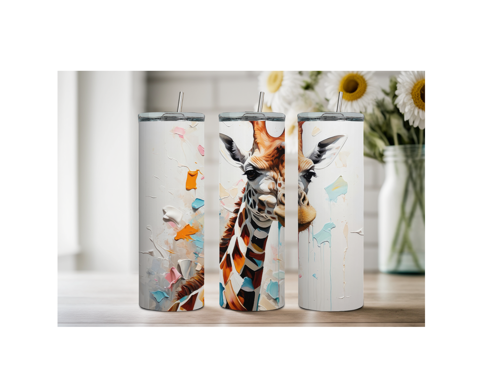 Three giraffe stainless steel tumblers showcasing vibrant designs on a wooden table with flowers in the background.