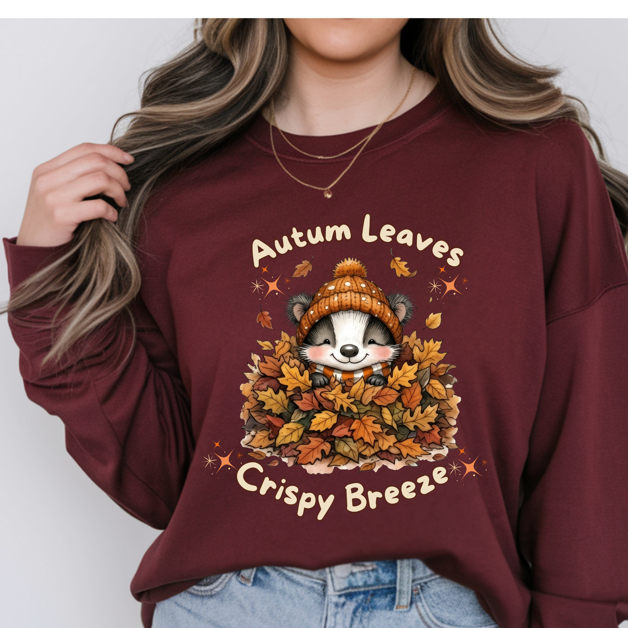 Autumn Leaves Long Sleeve Tee with a cute raccoon graphic, perfect for fall days, featuring an autumn leaves graphic tee design.