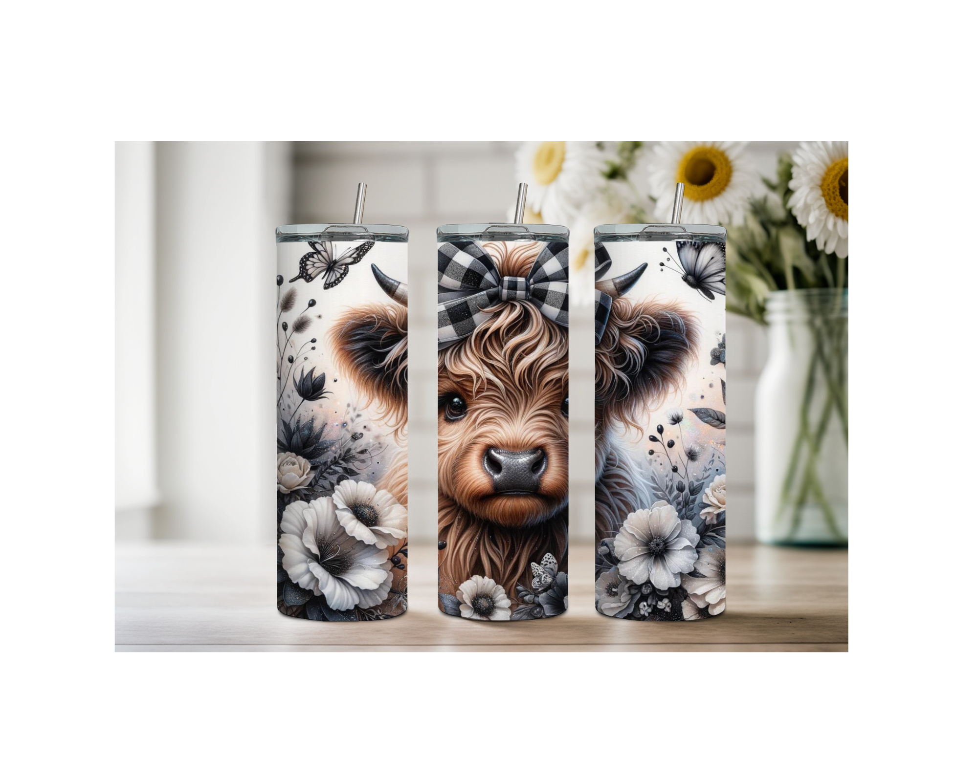 Highland cow stainless steel tumbler trio featuring charming floral designs and a cute cow motif.