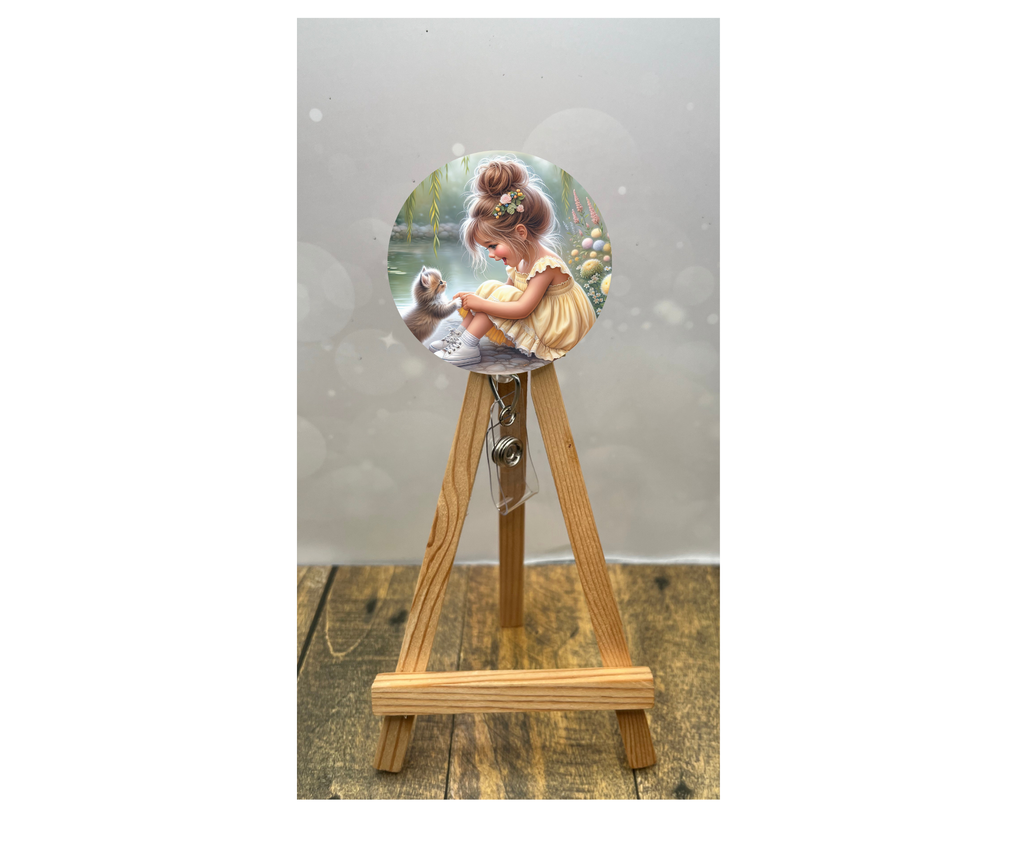Cat badge pulls for nurses featuring a cute girl illustration on an easel display.