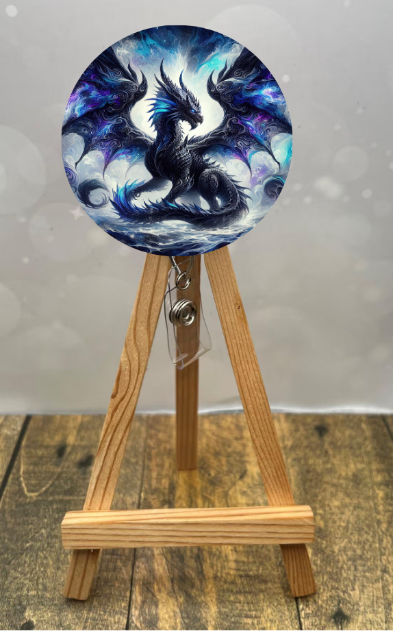 Dragon badge pull reel featuring vibrant dragon design on a wooden easel, showcasing fantasy flair for everyday use.