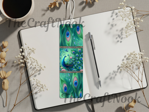 Aluminum peacock bookmarks featuring vibrant peacock designs on a notebook, coffee cup and decorative flowers.