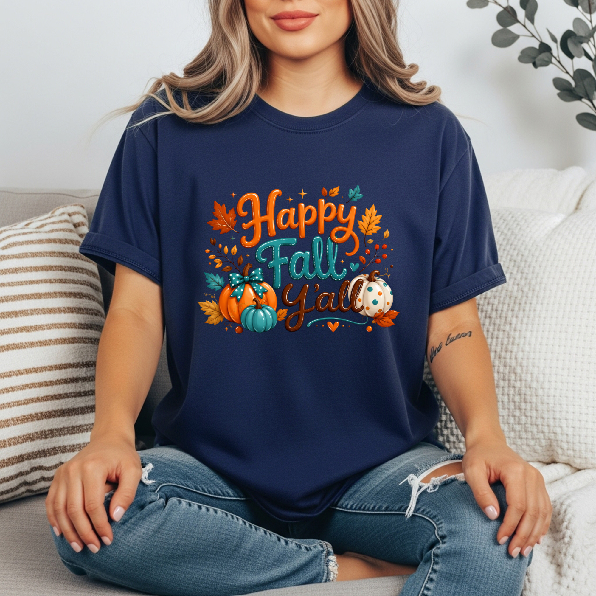 Happy Fall Tee worn by a model, featuring a colorful graphic design with pumpkins and leaves, perfect for the season.