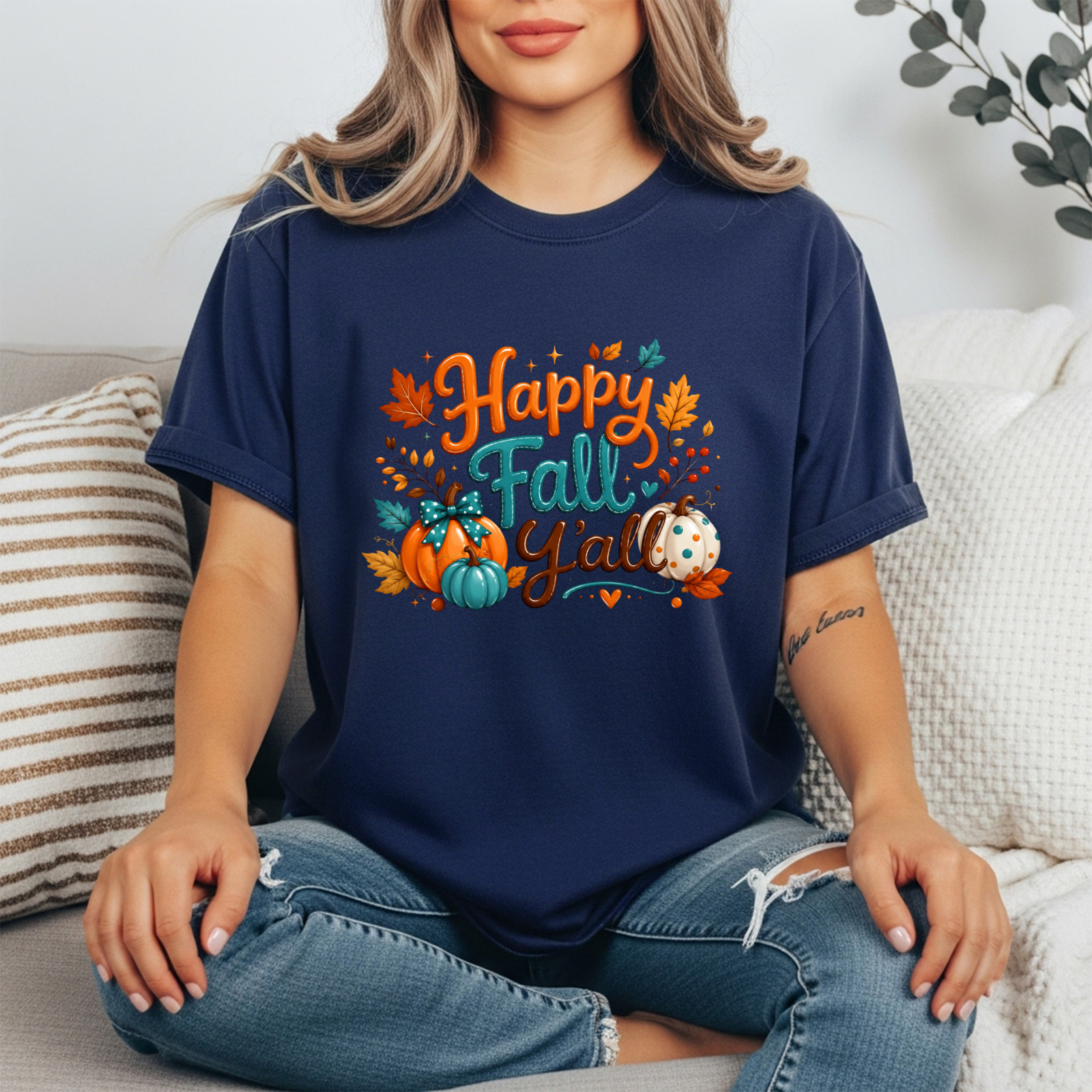 Happy Fall Tee worn by a model, featuring a colorful graphic design with pumpkins and leaves, perfect for the season.