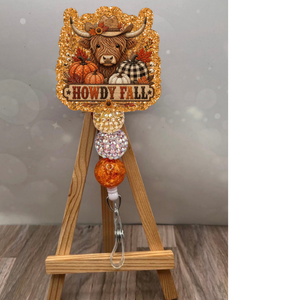 Howdy Fall Patchwork Badge Pull featuring a glittery design, pumpkin accents, and orange colors, perfect for fall patchwork badge reel lovers.