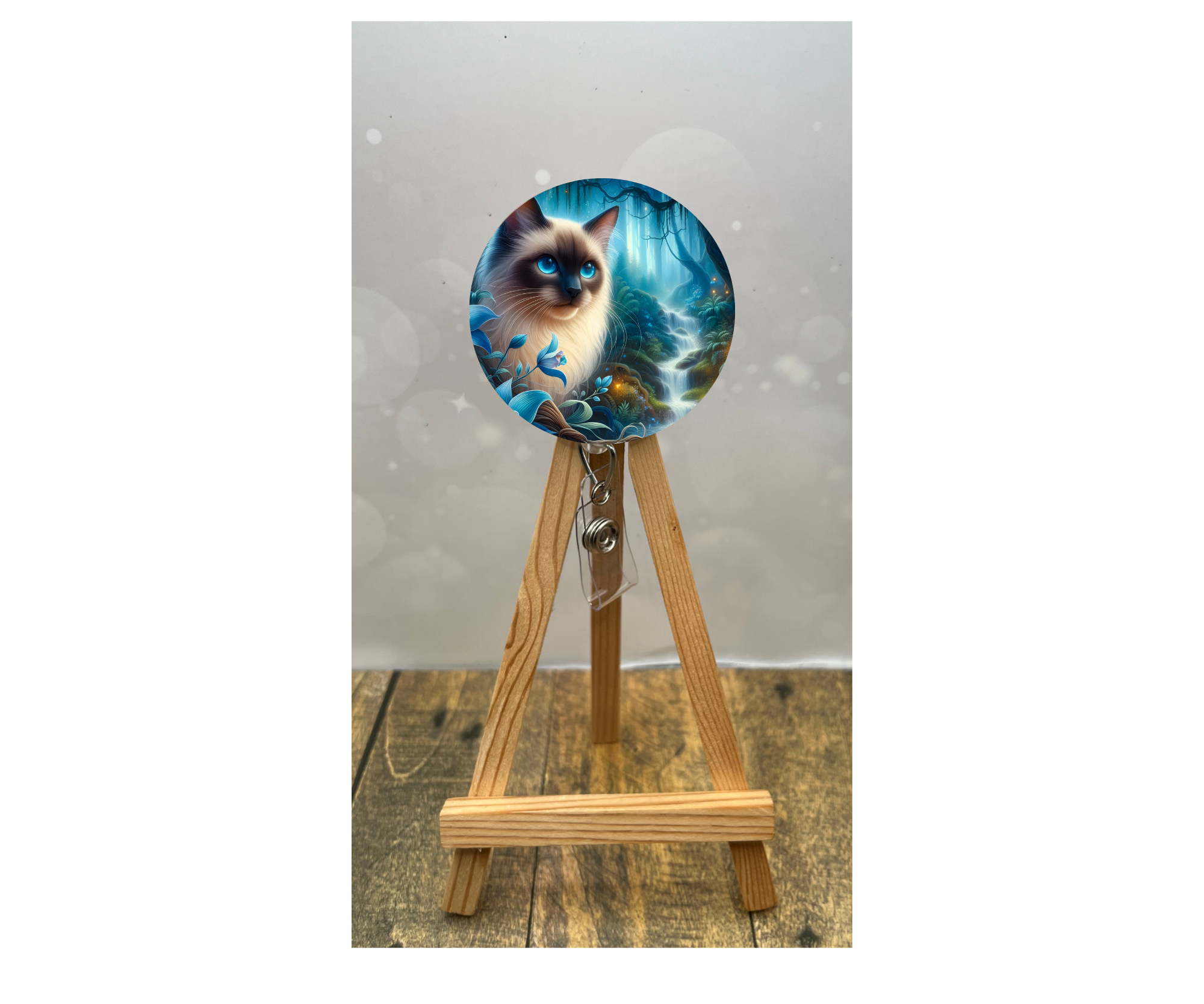 Cat badge pulls for nurses featuring a beautiful feline design on a badge reel displayed on a wooden stand.