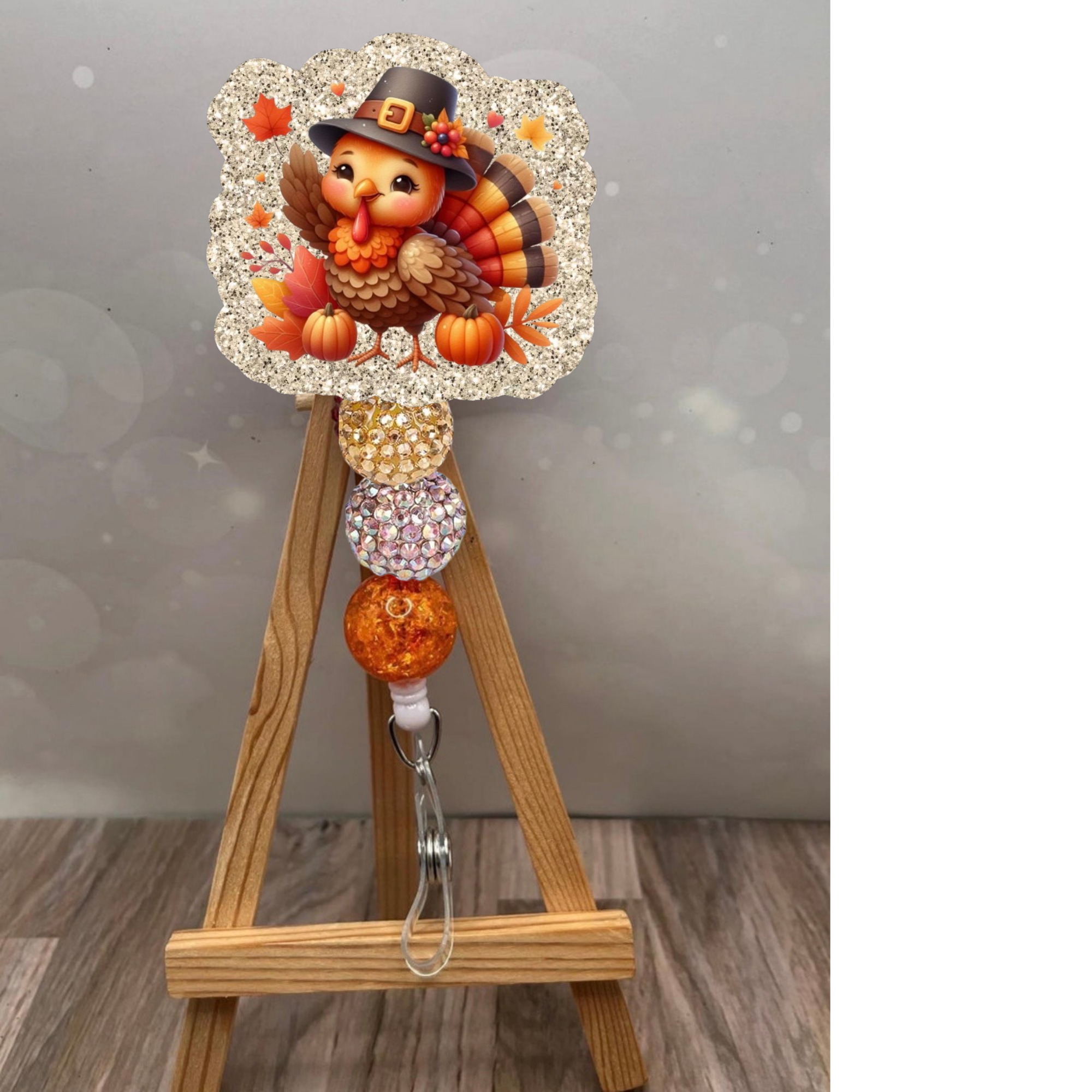 Cute Turkey Badge Pull with glitter background and colorful beads, perfect for festive celebrations.