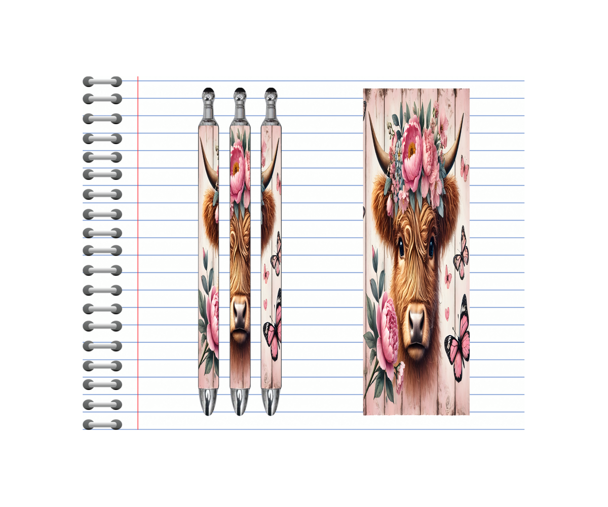 Highland cow refillable pens with floral designs and butterflies on a lined notepad background.