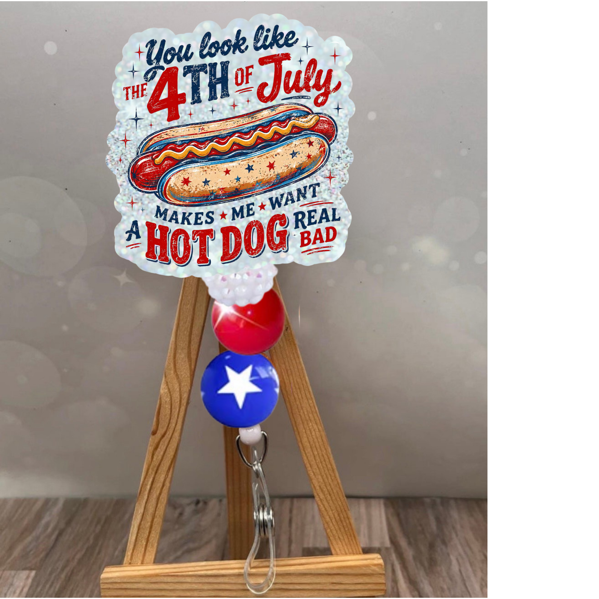 You Look Like the 4th of July badge pull with hot dog design and glittery background for office use.