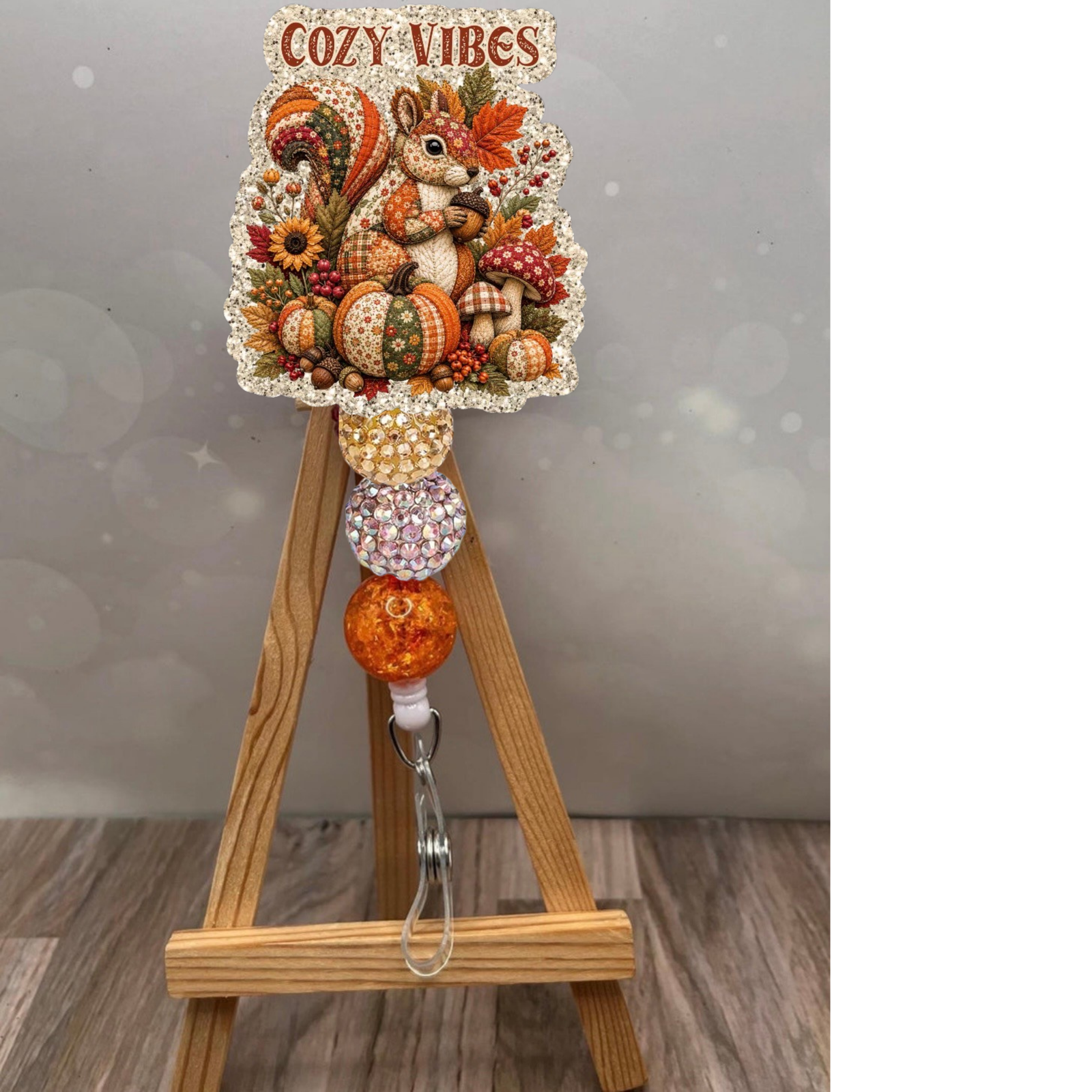 Patchwork Squirrel Badge Pull on display with cozy vibes and colorful autumn-themed embellishments.