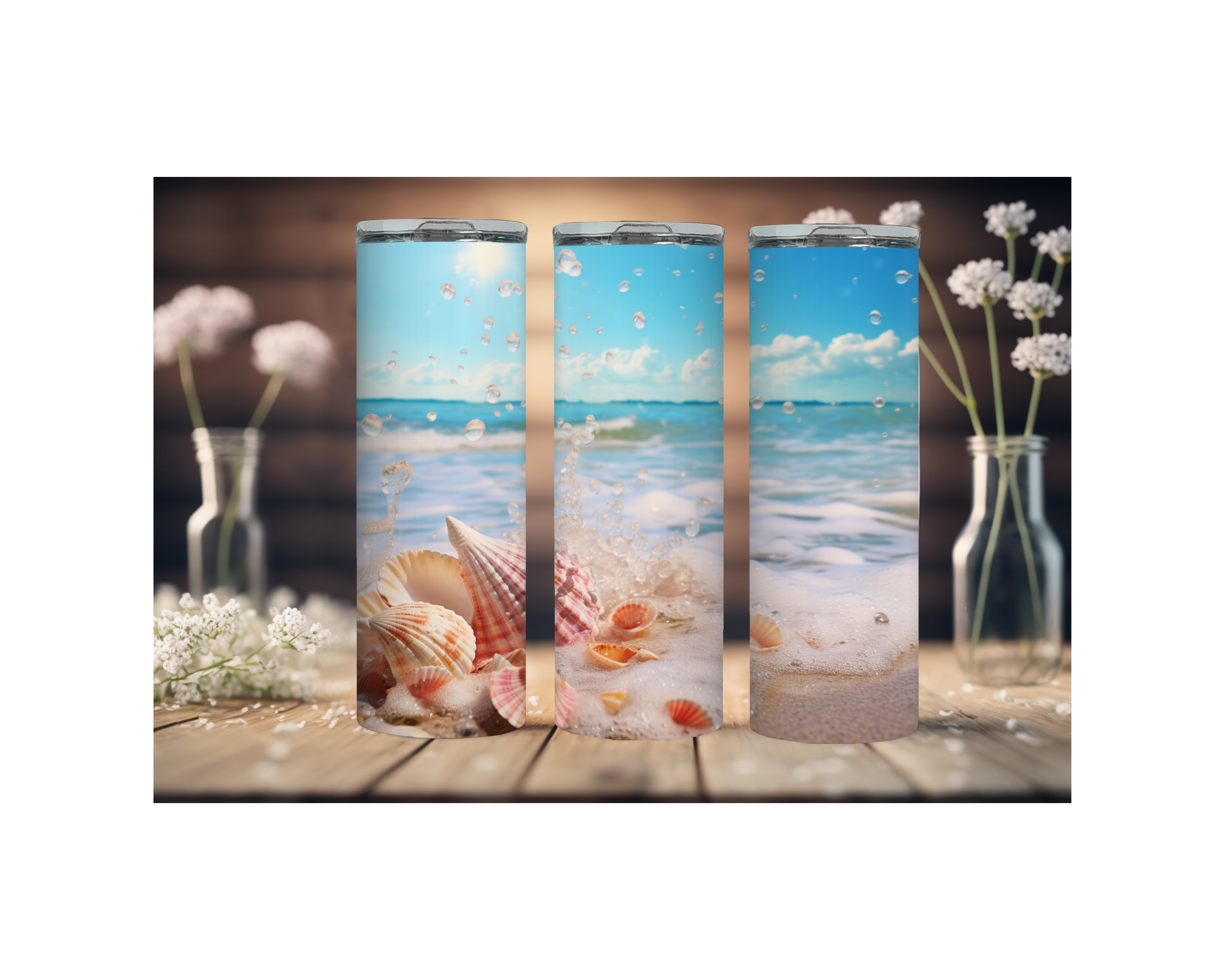Three beach stainless steel tumblers featuring ocean and seashell designs, ideal for keeping drinks cold.