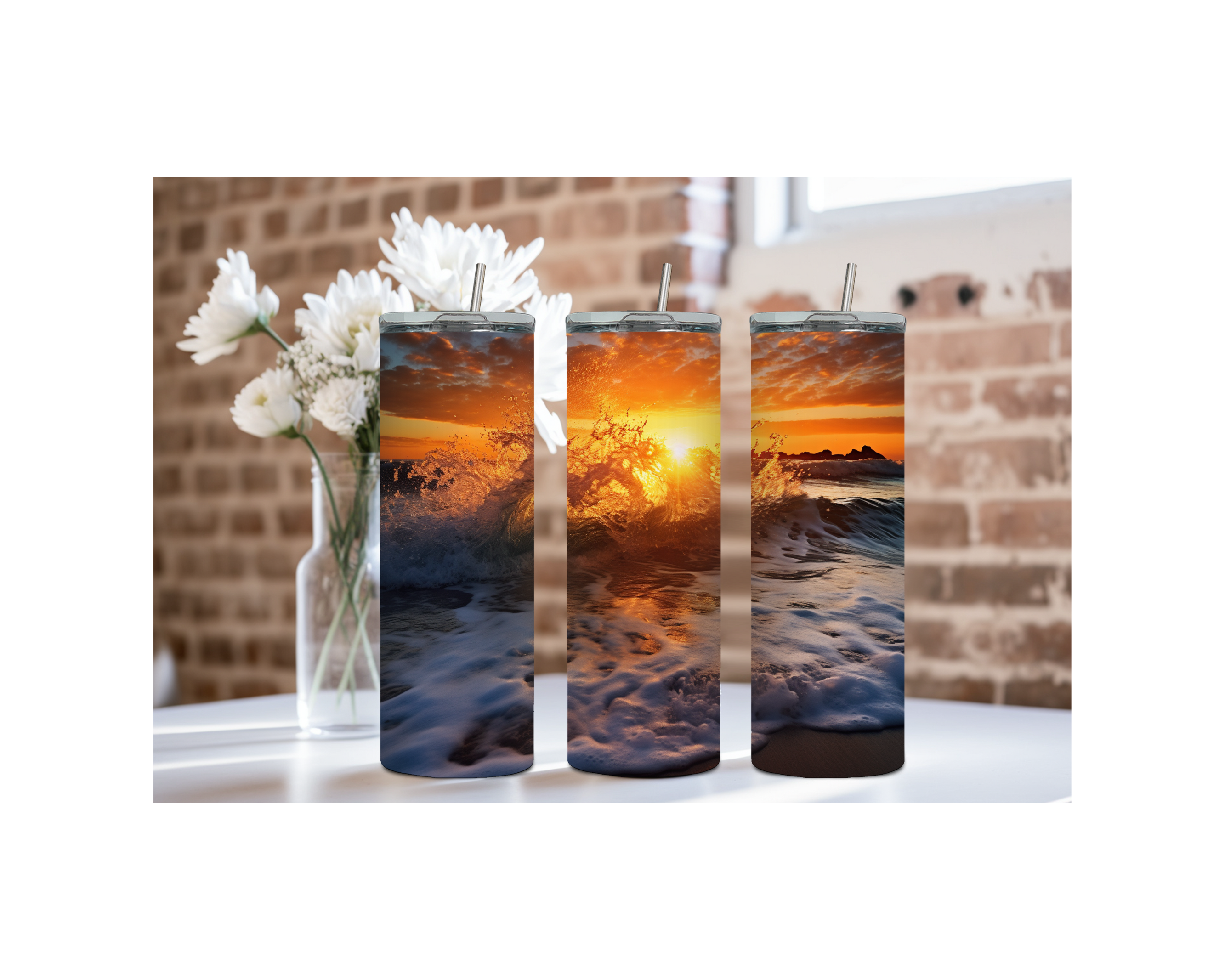 Three beach stainless steel tumblers with sunset and ocean waves design, ideal for refreshing drinks at the beach.