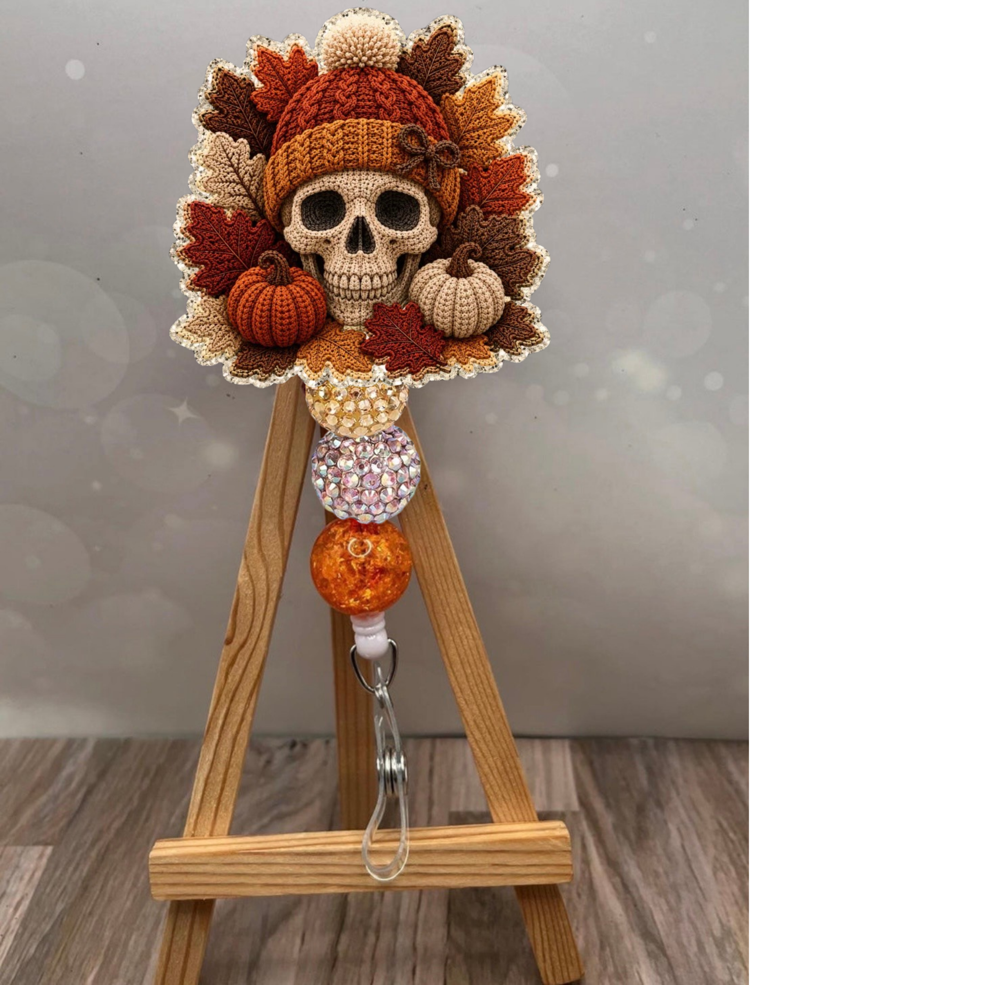 Fall Crochet Skull Badge Pull featuring a whimsical skull design with autumn leaves and pumpkins.