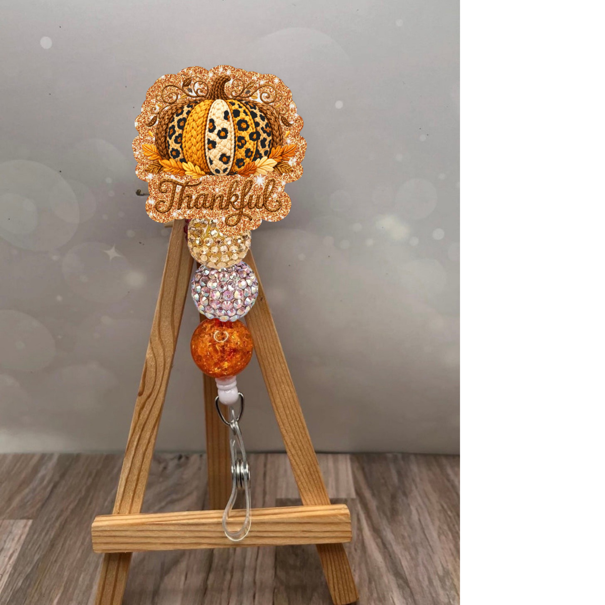 Thankful Crochet Pumpkin Badge Reel with glitter background and fall colors, perfect for nurses and teachers.