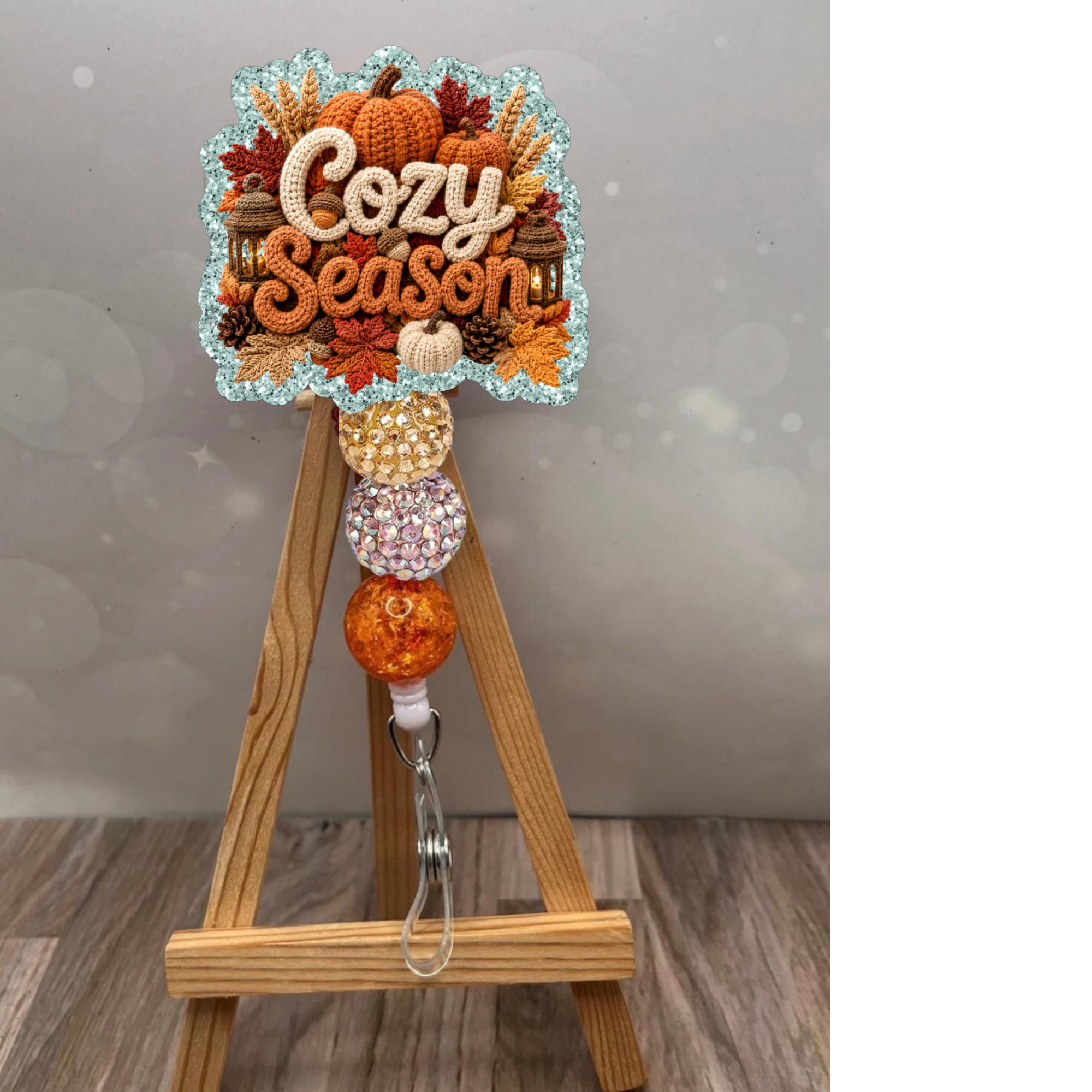 Cozy Season Badge Pull featuring a glitter background and decorative beads, perfect for fall-themed accessories.