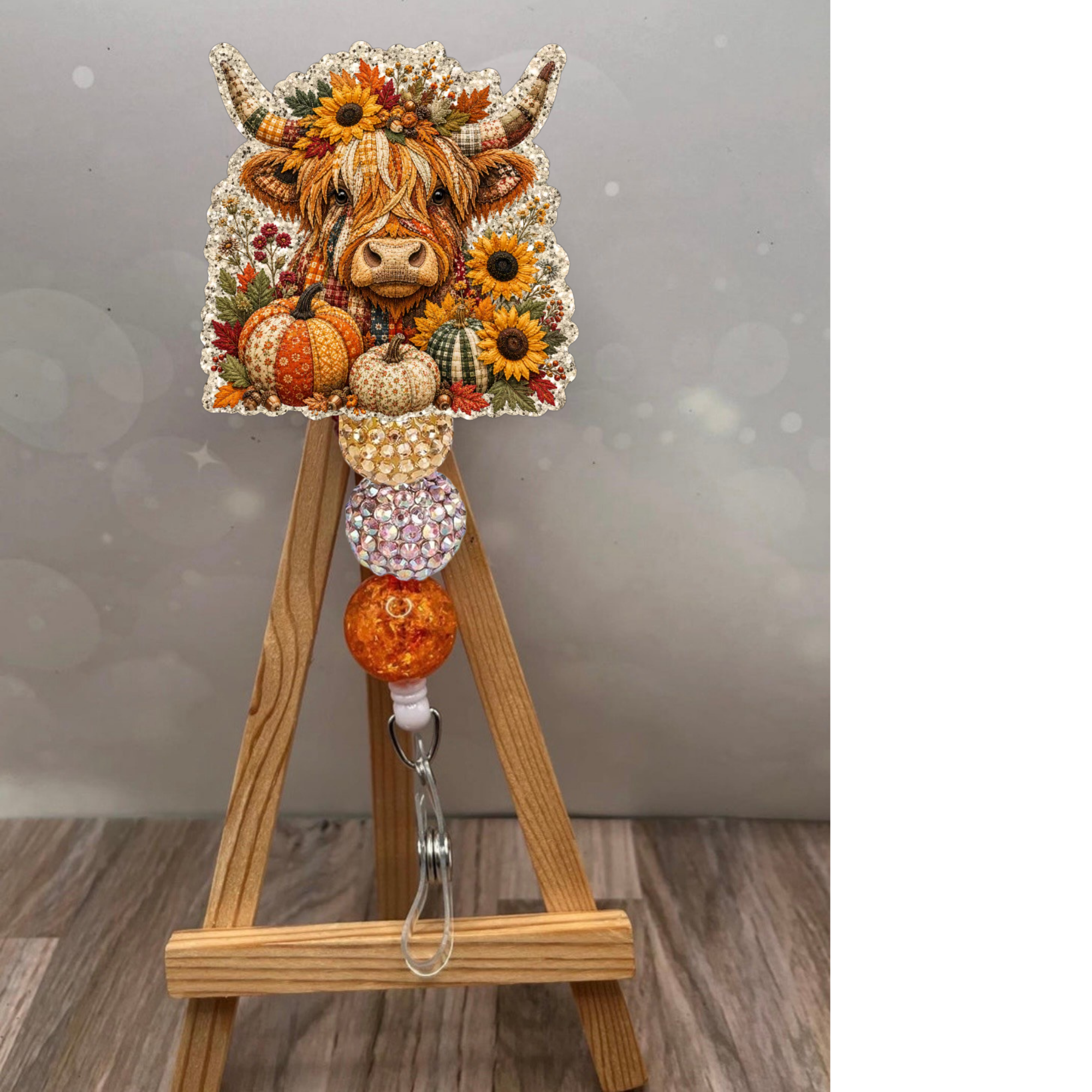 Fall Highland Cow Badge Pull featuring a fluffy cow and pumpkin design with a champagne glitter background.