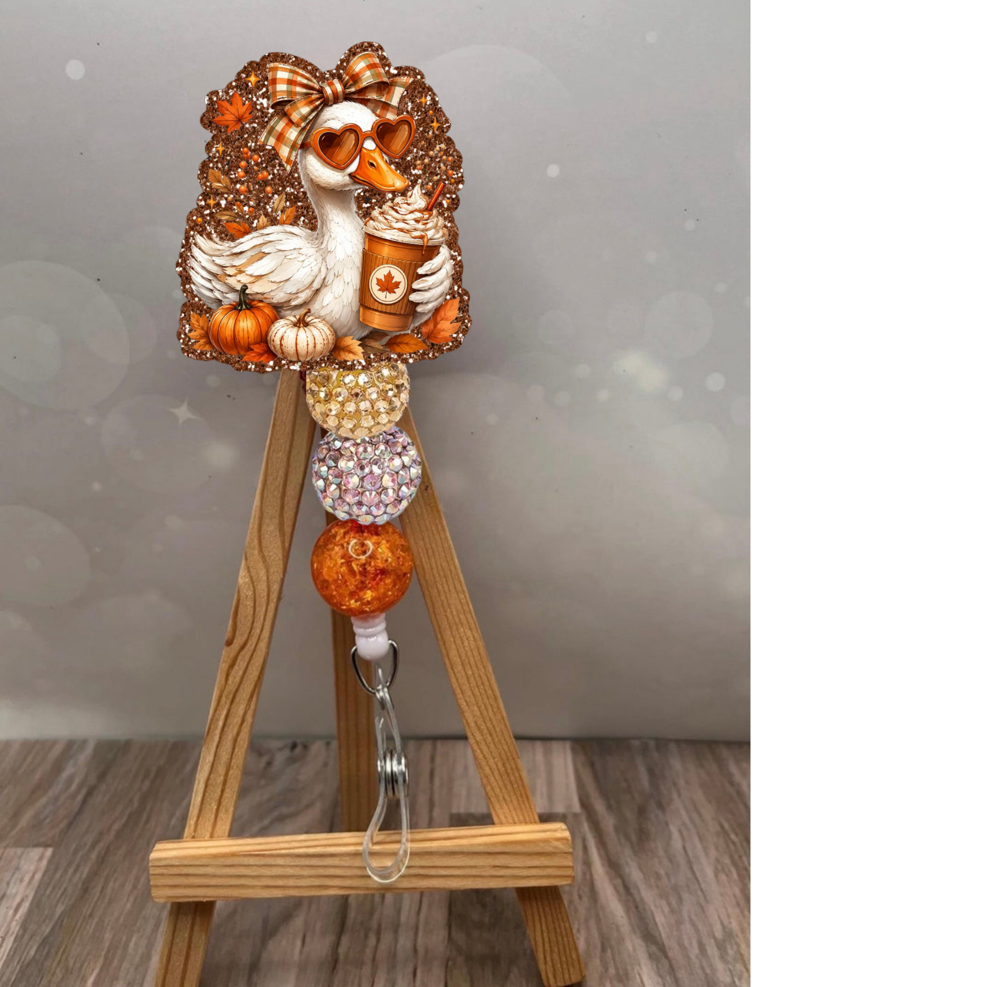 Fall Duck Badge Pull featuring a glittery duck design with pumpkin accents and retractable reel.