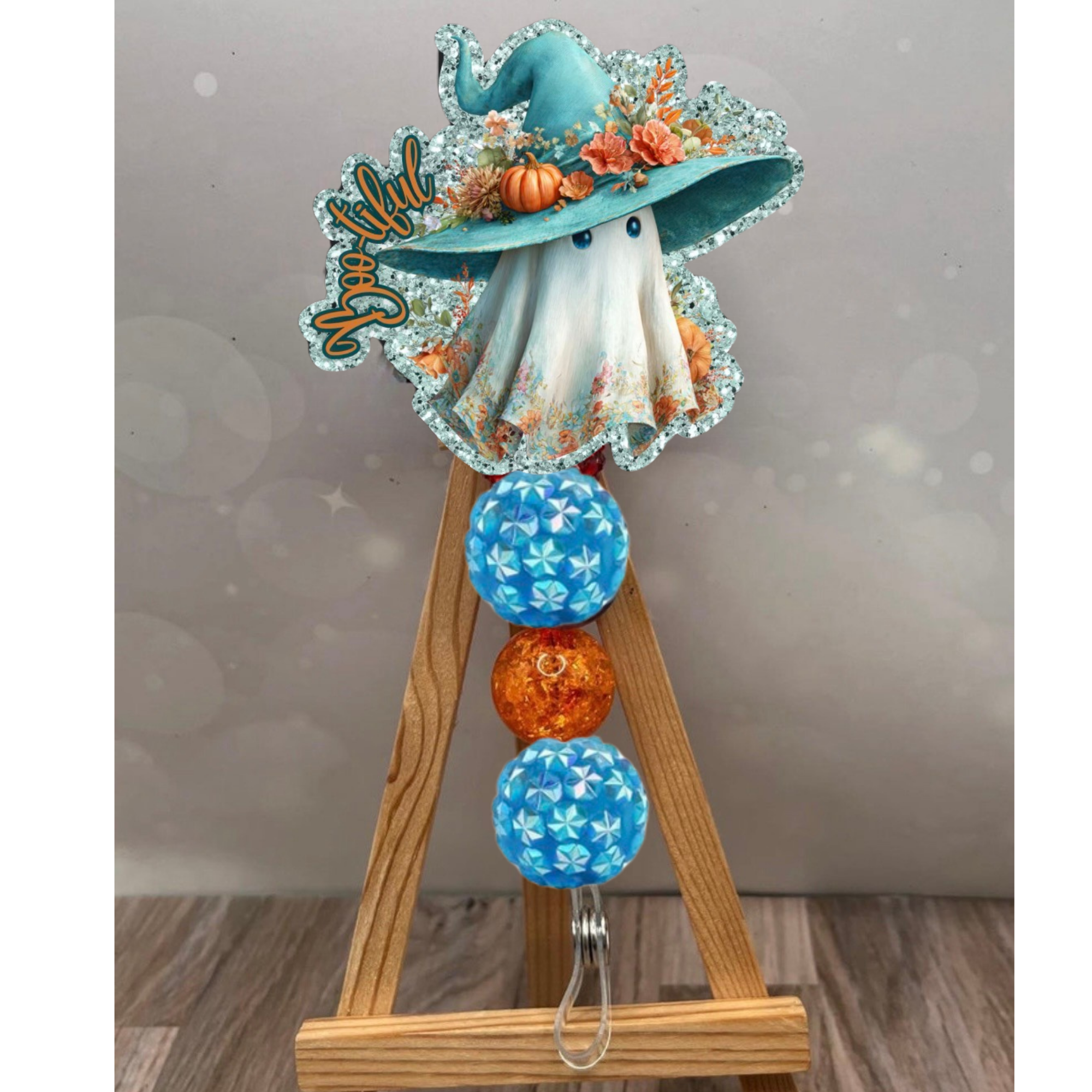 Boo-tiful Badge Pull featuring a ghost in a hat and vibrant decorative beads, perfect for a Halloween badge reel.