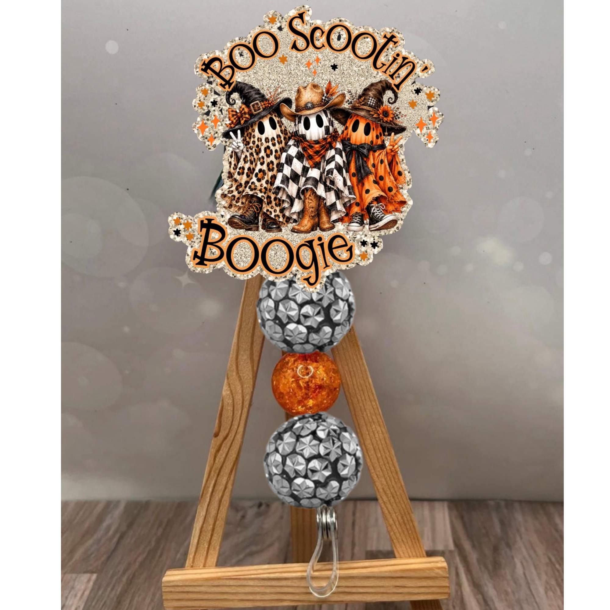 Boo Scootin Boogie Badge Pull for Halloween featuring glitter background and bead accents, perfect Halloween badge reel.