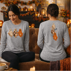 A woman shown from the front and back wearing a heather gray long-sleeve shirt with a Halloween ghost graphic. The front shows three ghosts in cream, black, and orange, while the back shows a larger vertical ghost design with a black cat and small bats.