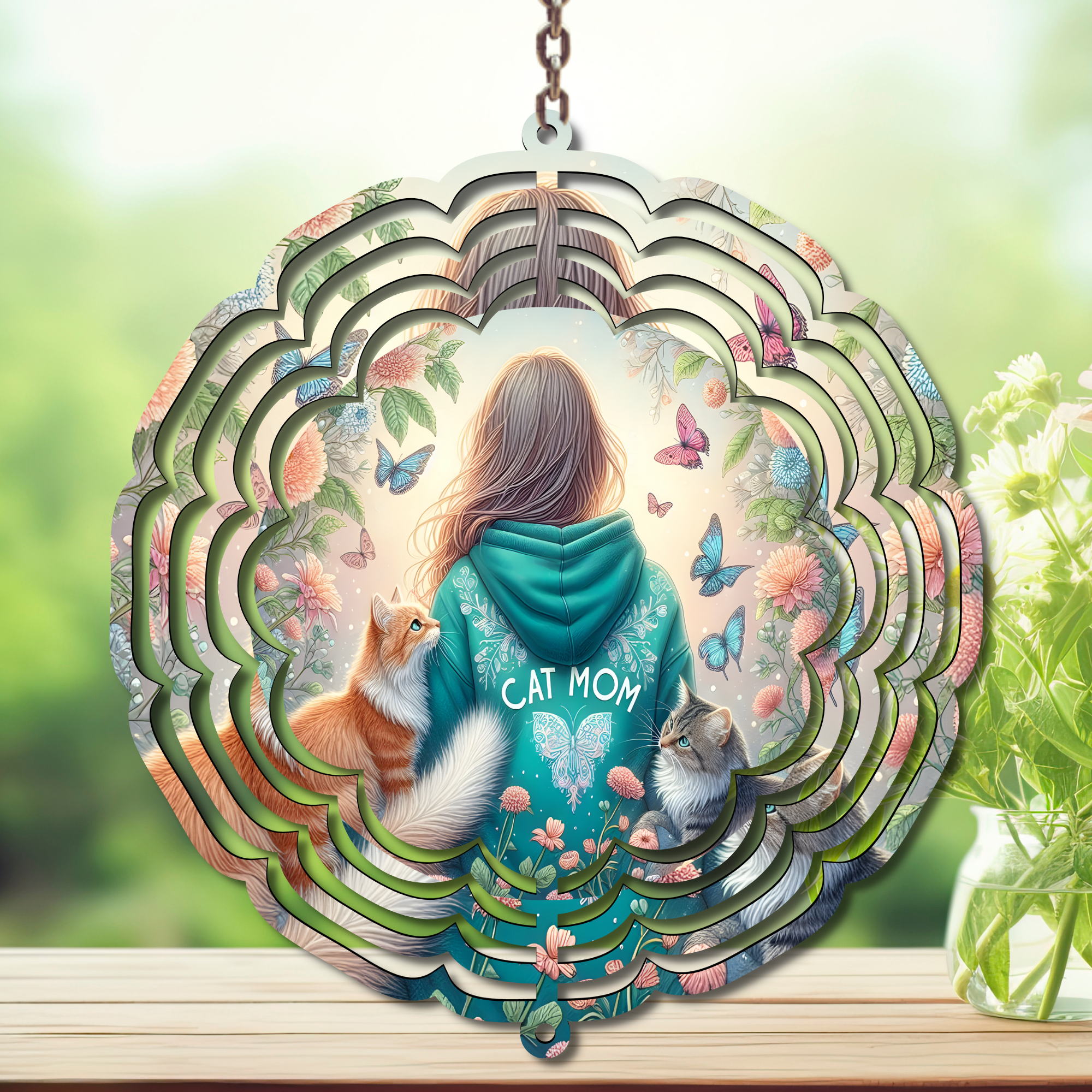 Cat wind spinner garden décor featuring a woman with cats and flowers, adding charm to outdoor spaces.