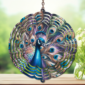 Peacock aluminum metal wind spinner displaying vibrant jewel-tone colors and elegant feather details in outdoor setting.