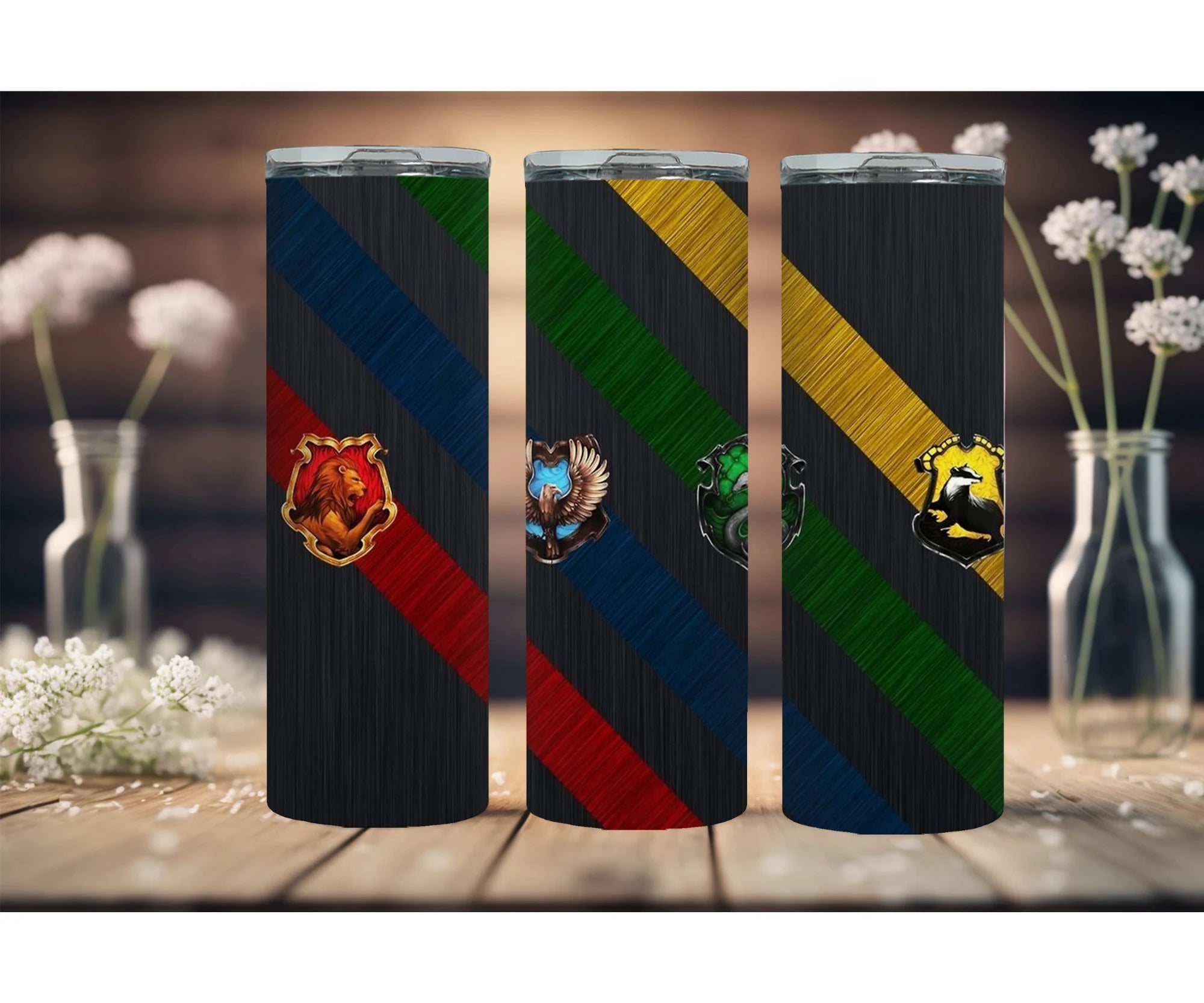 Wizard School stainless steel tumblers in 20, 30, and 40-ounce sizes with colorful house designs.