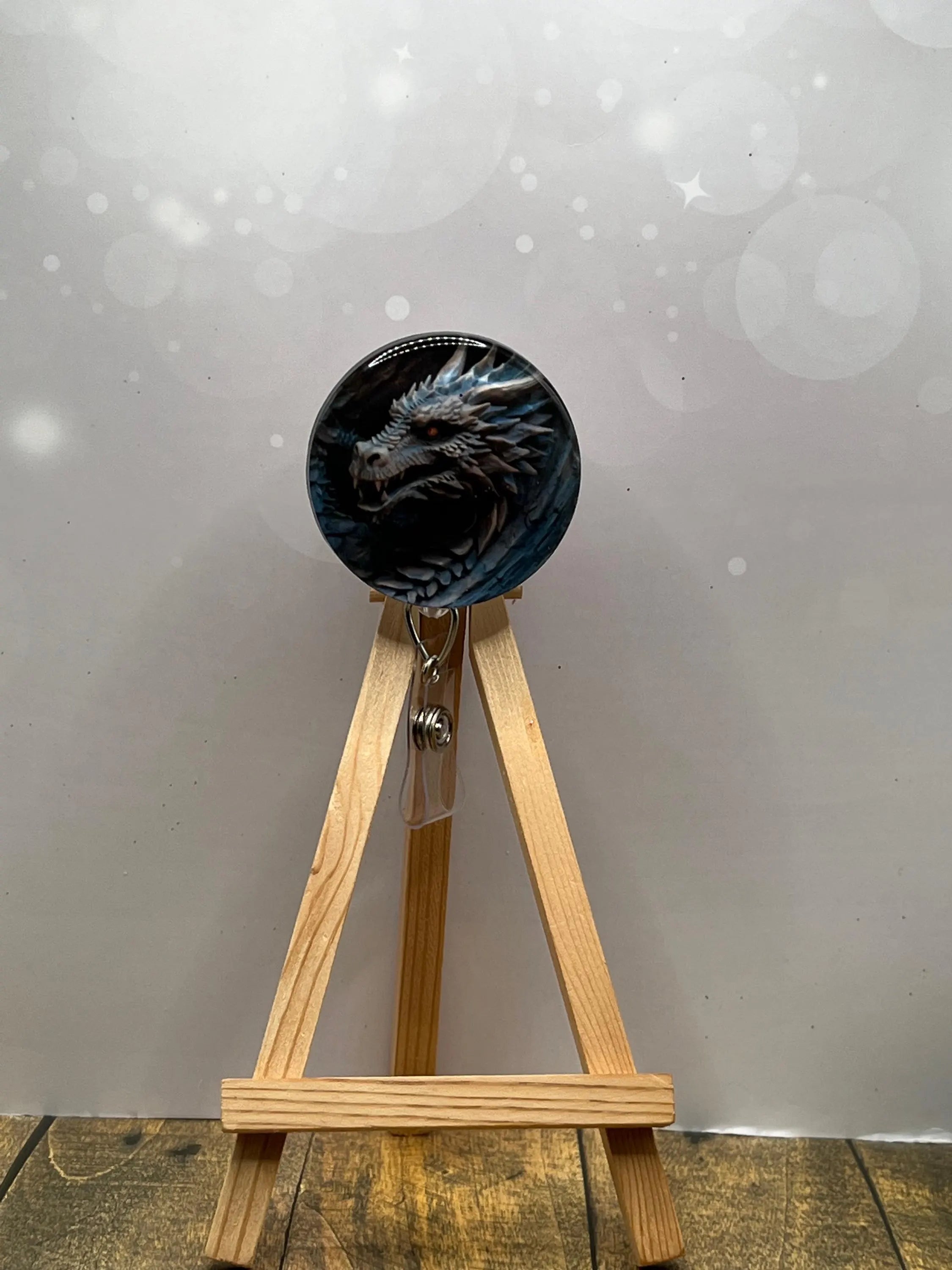 Dragon badge pull reel featuring a fierce dragon design on a retractable badge holder, perfect for adding fantasy flair.