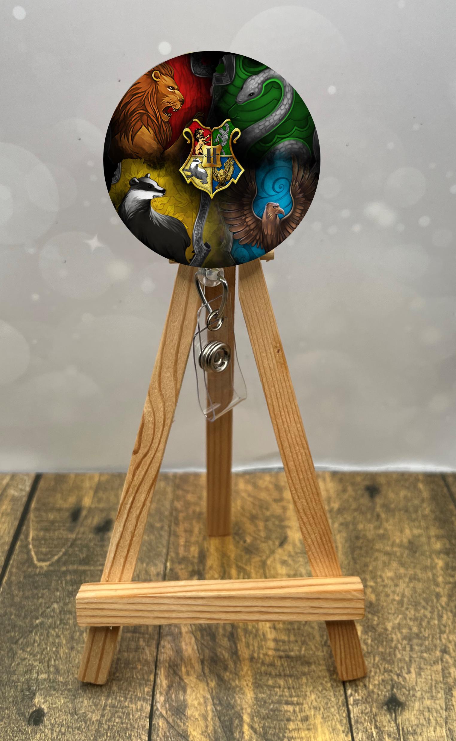 Whimsical wizard badge pulls featuring house animal designs and emblem, perfect for adding magic to your work.