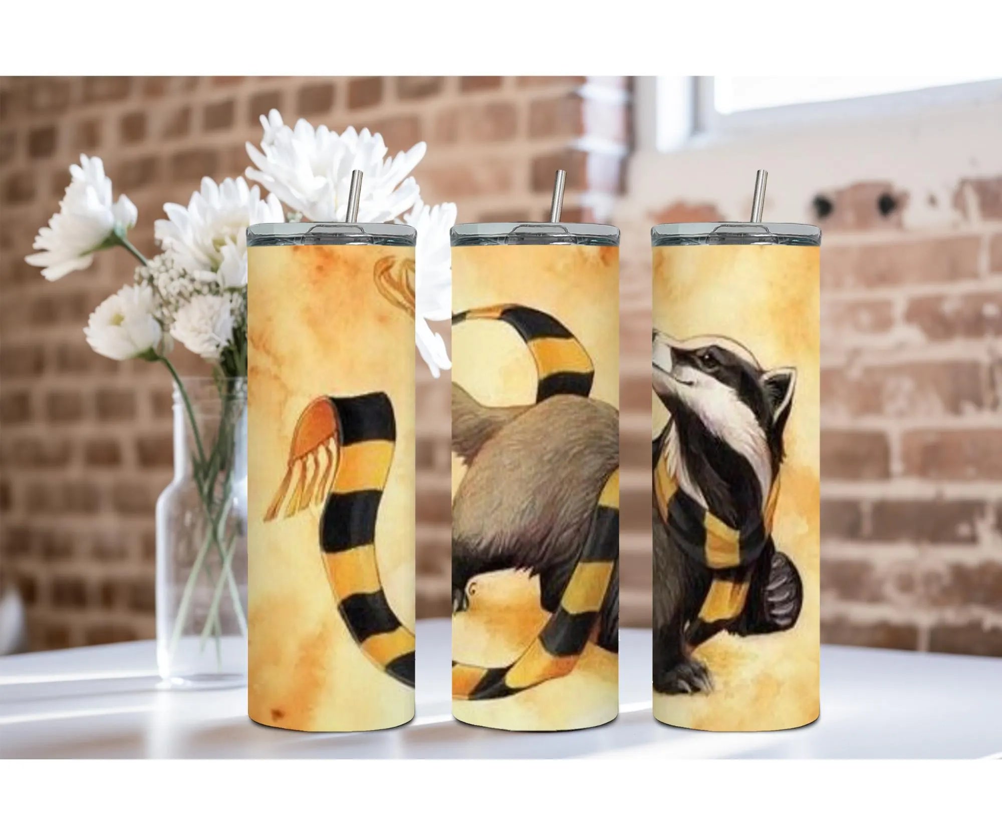 Badger House Pride stainless steel tumblers featuring unique designs with badgers and vibrant colors in a cozy setting.