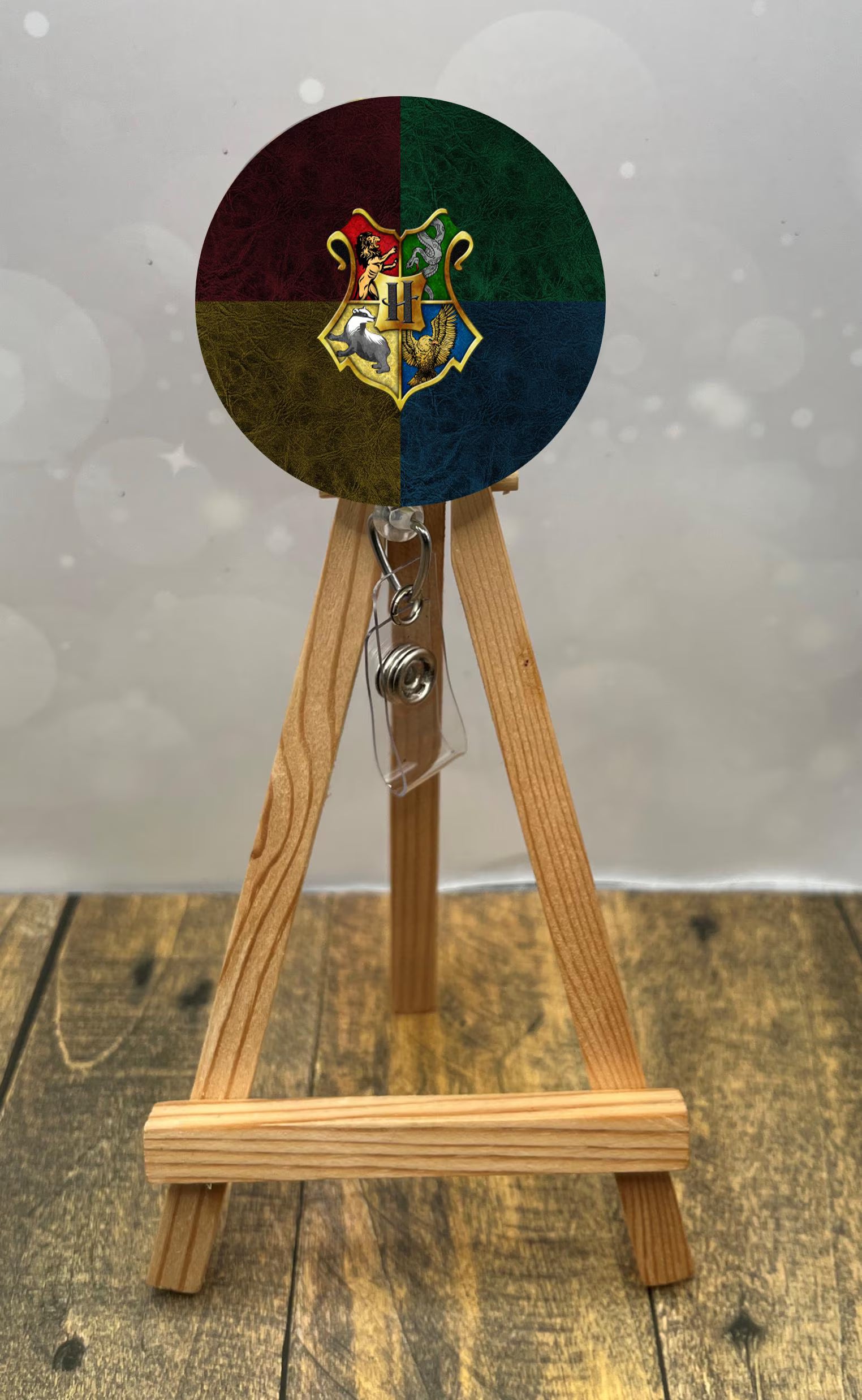 Wizard badge pulls on a wooden easel, featuring a colorful design with a magical emblem to add charm to your workday.