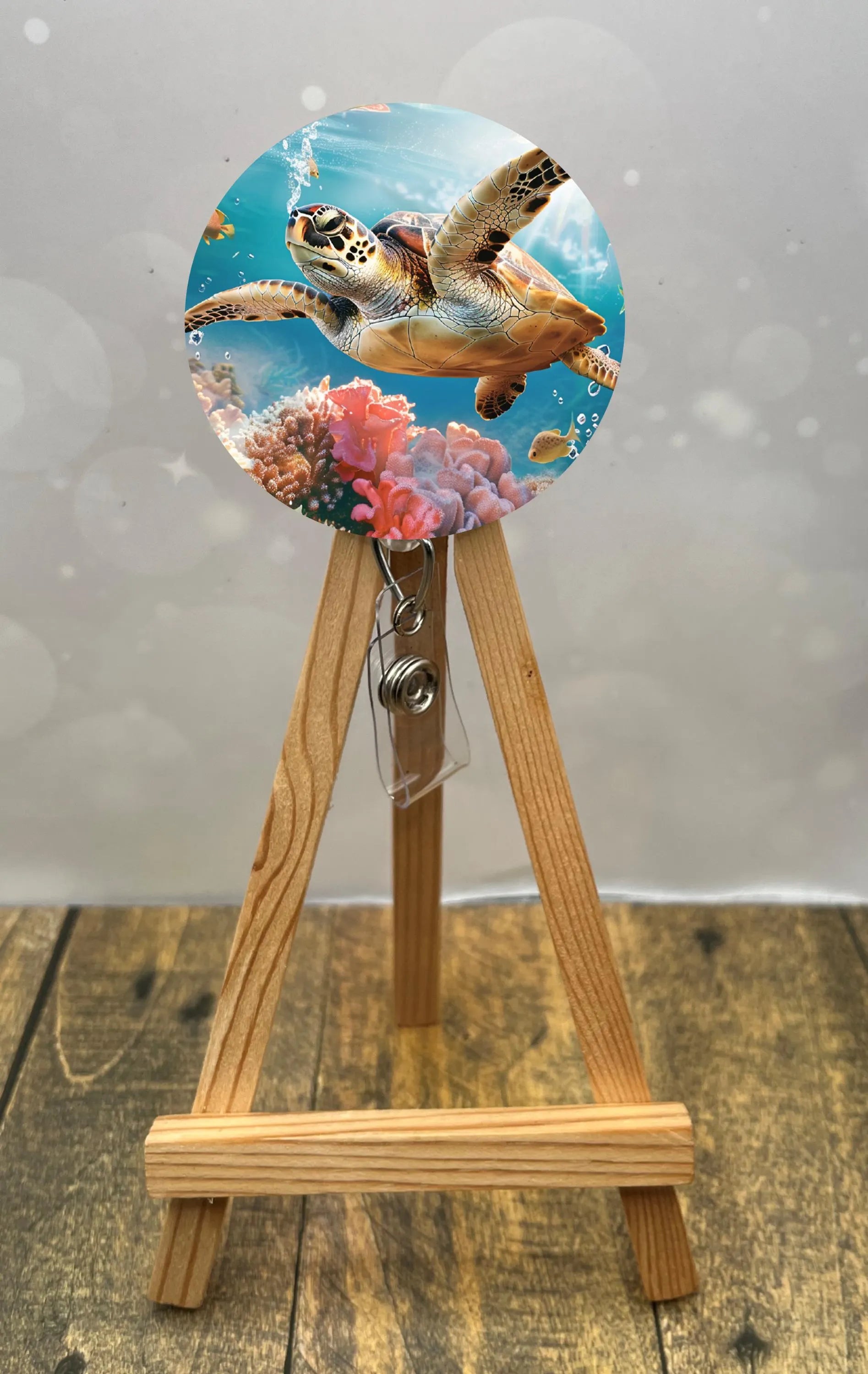 Sea turtle badge pulls featuring a vibrant turtle design with coral background, perfect for ID badges.