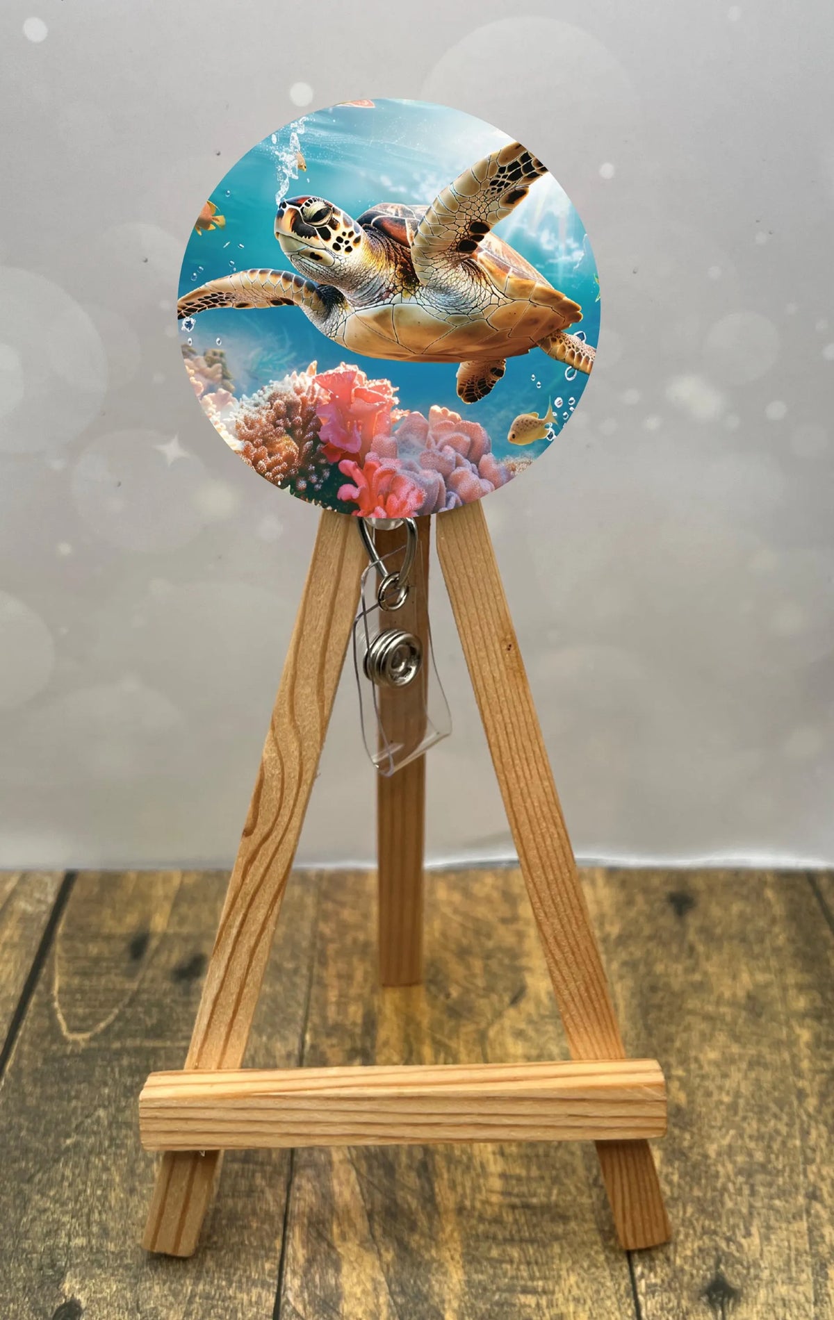 Sea turtle badge pulls featuring a vibrant turtle design with coral background, perfect for ID badges.