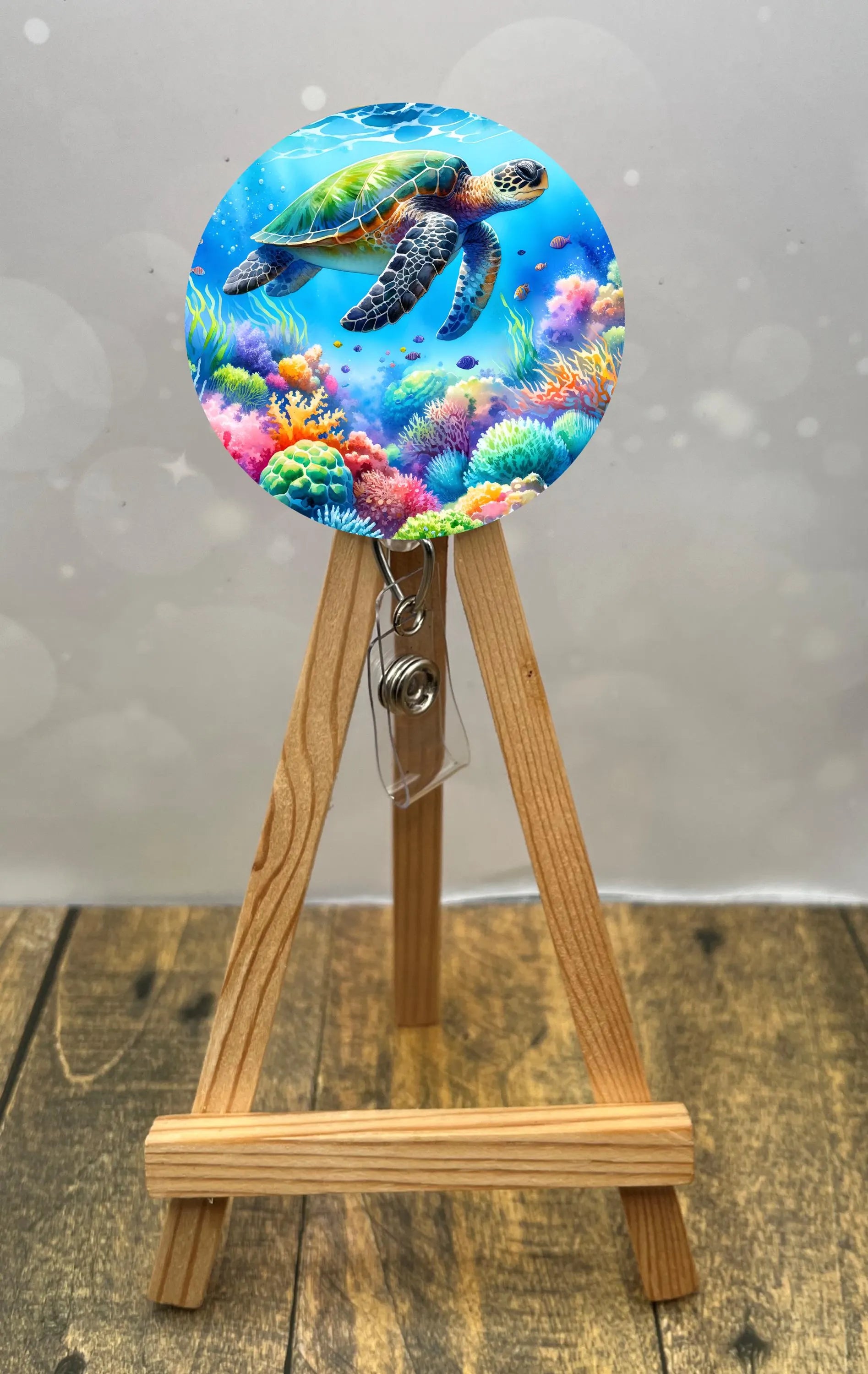 Sea turtle badge pulls featuring a colorful underwater scene, perfect for adding charm to ID badges.
