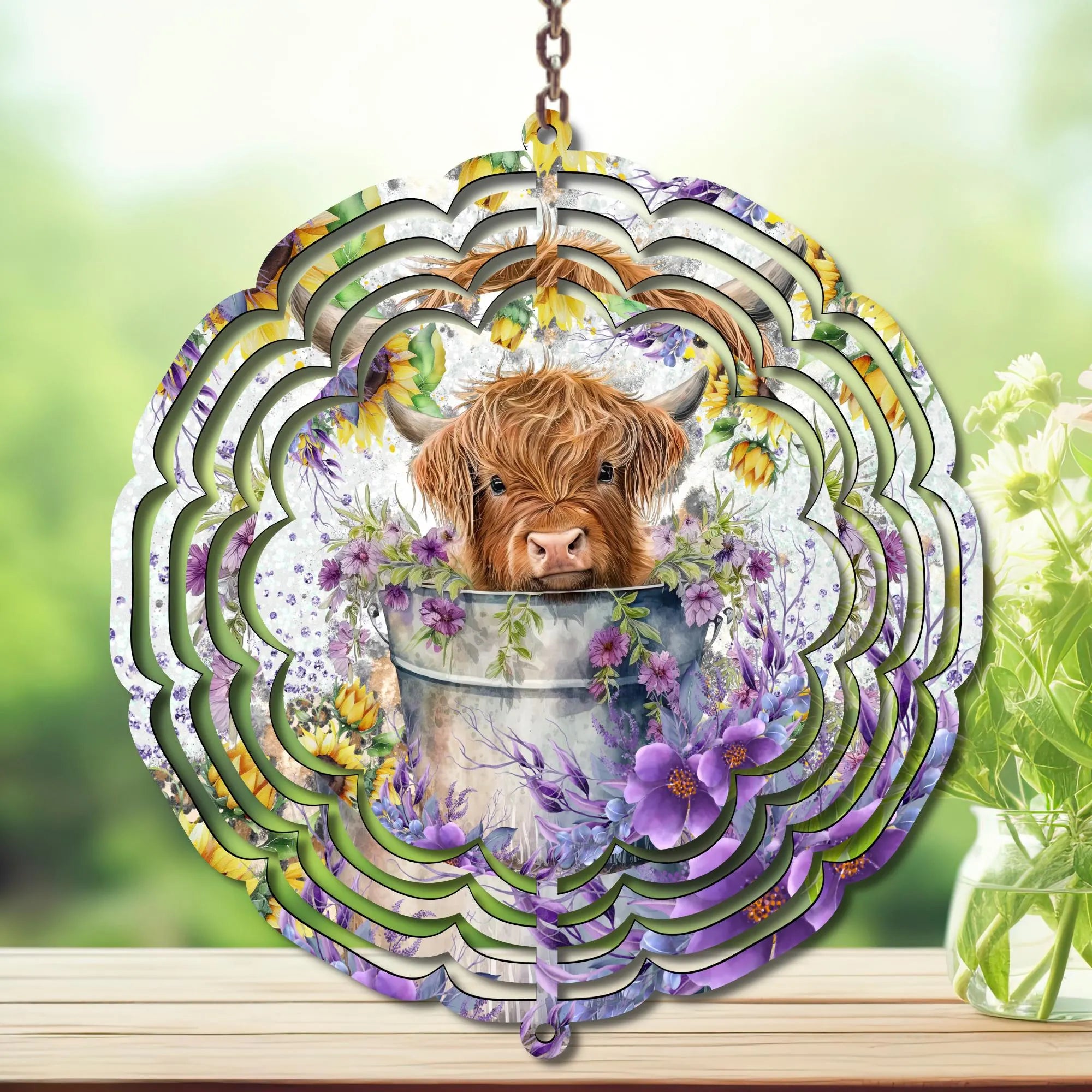 Highland cow wind spinner design featuring an adorable cow in a flower pot surrounded by vibrant floral patterns.
