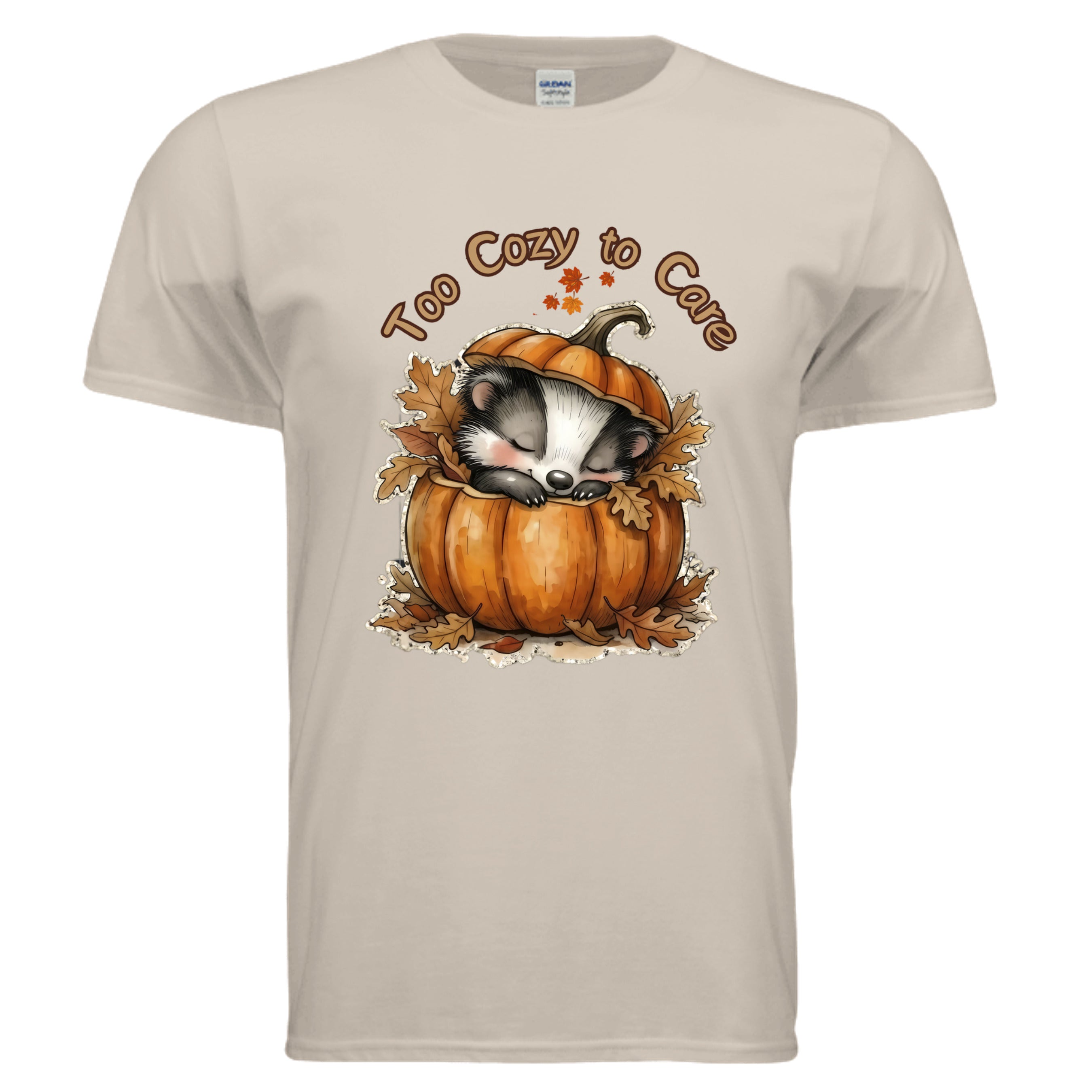 Too Cozy Graphic Tee in sand color featuring a cute badger asleep in a pumpkin, perfect for cozy graphic tee for fall.