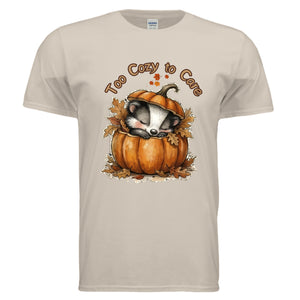Too Cozy Graphic Tee in sand color featuring a cute badger asleep in a pumpkin, perfect for cozy graphic tee for fall.